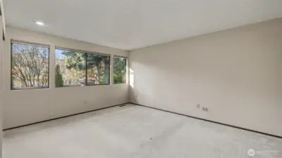 A bright, spacious primary suite with room to unwind and recharge.