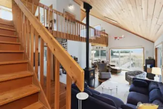 Stairway leads to the loft sleeping areas with elevated views of the surrounding landscape.