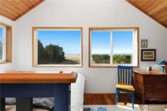 On winter days, watch the storms roll in over the water. (trees topped by AI)