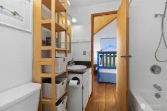 Full bathroom conveniently located between the two loft sleeping areas.
