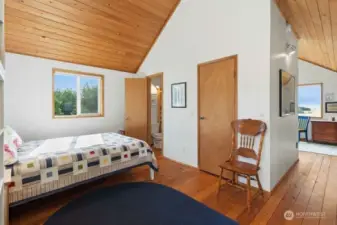 Beautiful wood ceilings and exposed beams create a warm and inviting sleeping space.