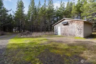 Spacious garage with room to park a vehicle and store beach gear.