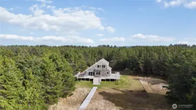 2.5 acres (and growing) provides rare privacy and space along this peaceful stretch of coastline.