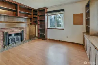 Den/Office/Work Area With Fireplace And Built In Cabinets