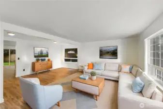 Here is your virtually staged large living-dining room with new lvp flooring and new interior paint