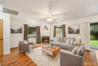 Here is virtually staged second living family room at back of home with built in gas fireplace with ceiling fans to move heat and cool air around.  Family room is just off open kitching area and patio for lots of fun