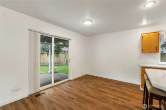 Second eating area off kitchen leading to covered patio