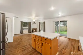 Kitchen island with lots of storage under counters and view to back yard