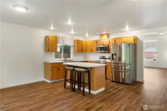Nicely updated kitchen with lots of counter top space with recessed lighting
