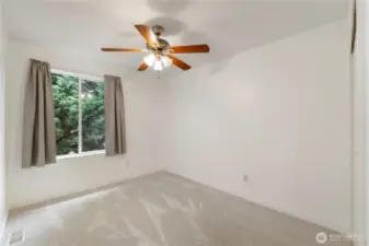 View of bedroom #4 with ceiling fans and big window too look out
