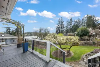 The wrap around deck offers plenty of opportunities to enjoy the property and the water & Mt views!