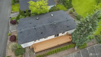Drone overhead view, with Community greenbelt lawn in the background (HOA mows).