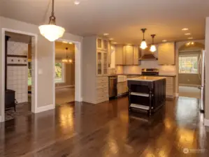 Looking into the kitchen from the Keeping Room and view of the wood stove