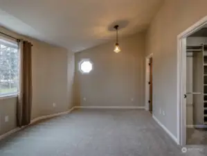 Primary Bedroom showing entry to 2nd walk-in closet and bath