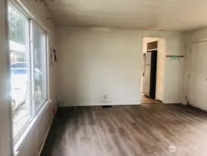 This modest home is certainly liveable but needs some love! Bring your paint brush, patch a few holes and make this living room all your own.  Dual pane vinyl windows throughout.