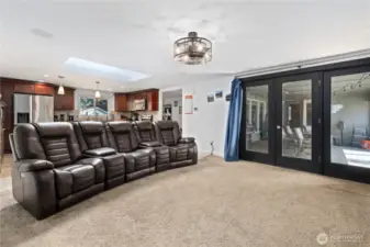 2nd living area with access to covered patio and the open kitchen