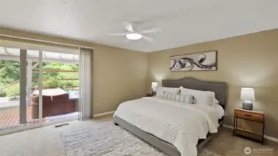Enjoy private backyard access from the primary bedroom, where a relaxing hot tub awaits just beyond the sliding door.