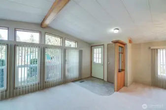 Large living room w/cathedral ceilings, new carpet, paint, triple pane windows