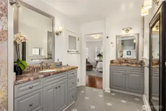 Charming Carmel~style tiled primary bath features walk-in tiled shower.