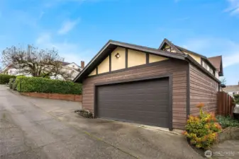 Unique to North Tacoma is the fully finished 2 car garage. The owners have added EV Charging to the garage space as well as to the side parking pad. Easily accessed from the home's paved alley. The back entry is gated, key locked and fully fenced, newly professionally landscape backyard.
