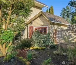 Adorable cottage-inspired garden shed full of charm and character.