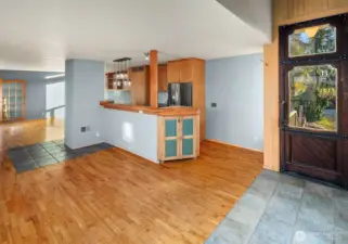 Entryway leads right to the galley kitchen and dining area, because everyone gathers in the kitchen.   Bright and welcoming space to gather and make memories over breakfast and dinner.