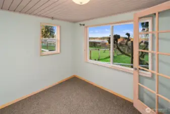 Another lower level bedroom with a view.
