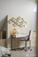 An ideal work-from-home setup, the loft workspace overlooks the secondary living room and keeps you connected while working in comfort.