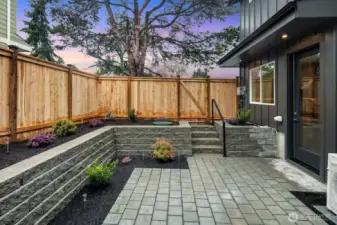 Level and fully fenced patio area - perfect for pets and entertaining outdoors.