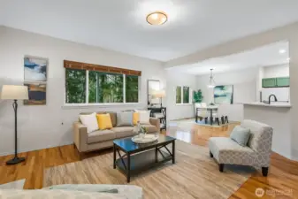 living room with view to backyard and dining room kitchen area