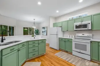 kitchen with view into dining room and backyard