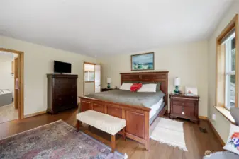 Another view of the primary bedroom with an adjoining private bath.