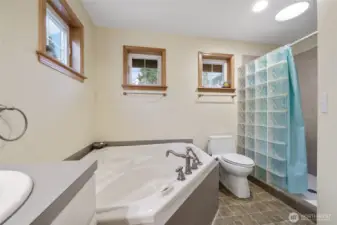 The primary bath also features a separate shower.