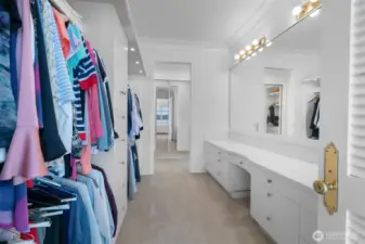 One of the walk in closets serving the primary bedroom.