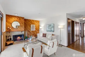 A large Living Room with new carpet throughout and a wood burning fireplace for those cozy evenings. Beautiful woodwork continues throughout the home.