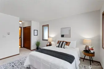 Double closets conveniently located between the bedroom and bathroom.