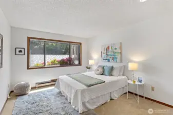 The large second bedroom framed with colorful rhododendrums at this time of year!