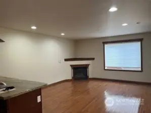 Looking back from the kitchen area toward the fireplace and living room.