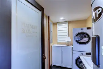 Laundry room with built-in ironing board in cabinet