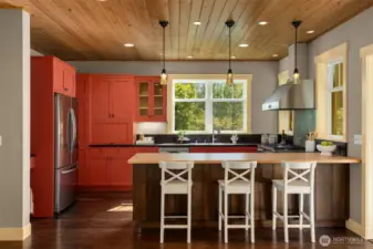 Inspired kitchen with peninsula seating and desk "nook"