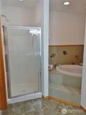 Master Bathroom w/ soaking tub and walk-in shower.