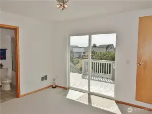 2nd-level: 2nd Bedroom w/ private bath and a slider to the Rear Deck.