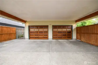 Two-car garage also has an adjoining 2-car carport with convenient alley-access.