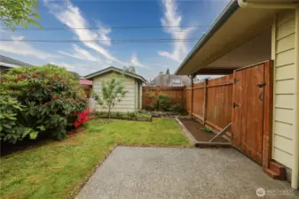 Back patio is fully fenced and offers great privacy-- garden shed is easily accessible.
