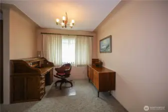 This space off the kitchen can be an office or for a more formal dining area.