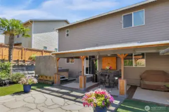 Patio cover protects from rain & sun. Drop-down shades retain heat during winter.