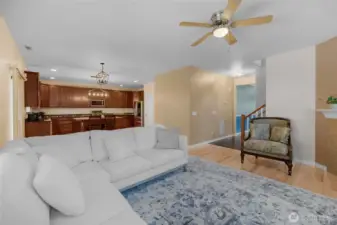 Living room w/ open floorplan connects the kitchen, dining area and living room.