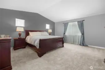 Spacious primary bedroom with ample light.