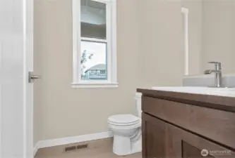 Powder room on main floor is ideal for guests.