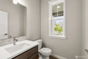 Powder room on main floor is ideal for guests.